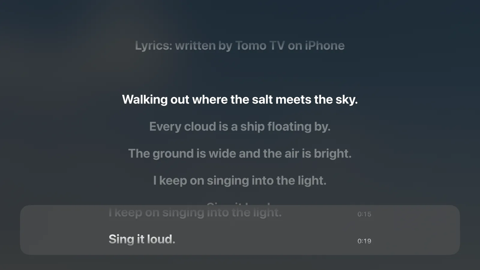 The Apple TV player with a panel at the bottom showing two lyric lines and their times, 0:15 and 0:19, over the lyrics