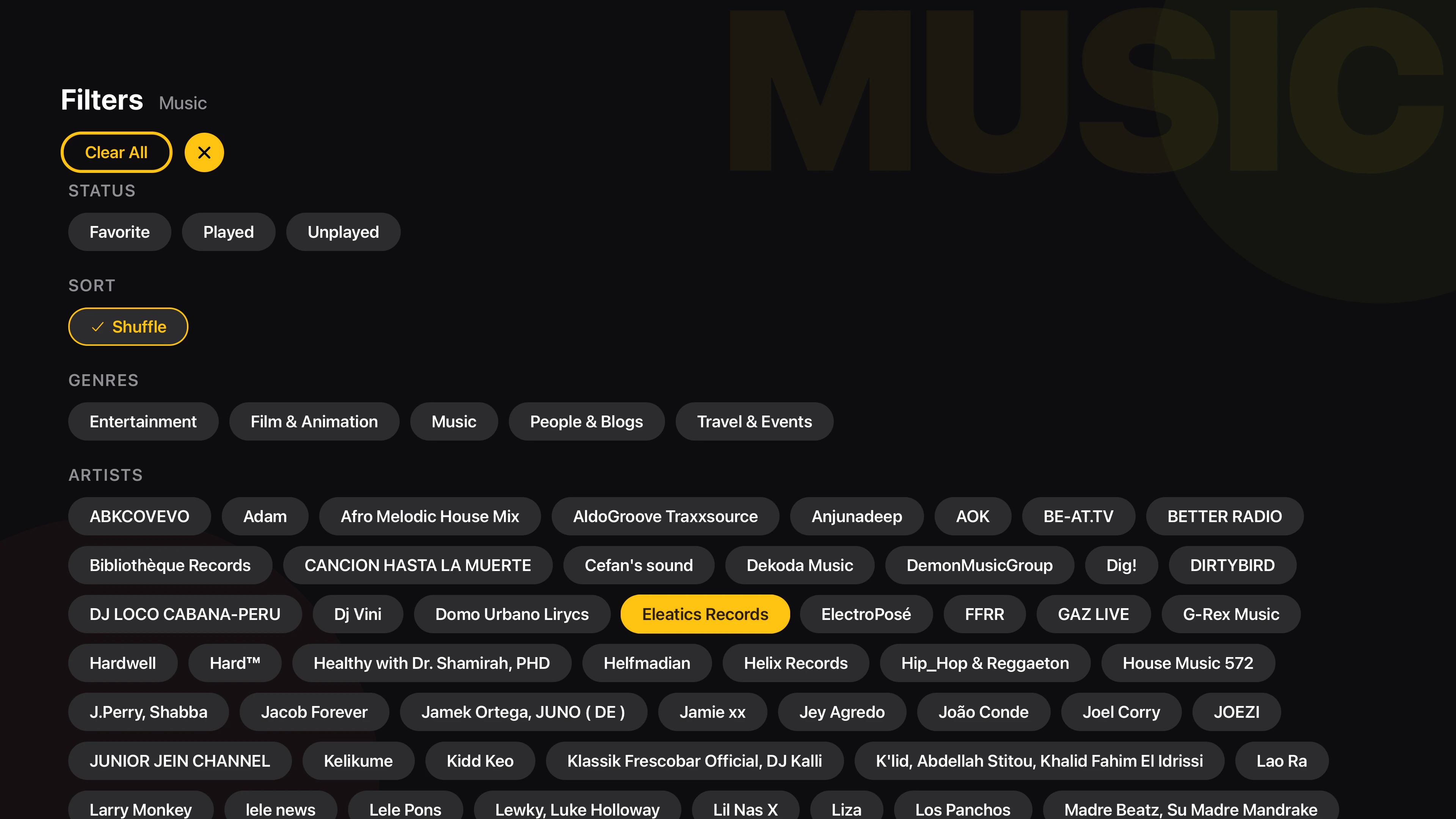 Tomo TV Filters panel for a Music library with Status, Sort with a Shuffle toggle, Genres, and Artists chips, plus a Clear All button
