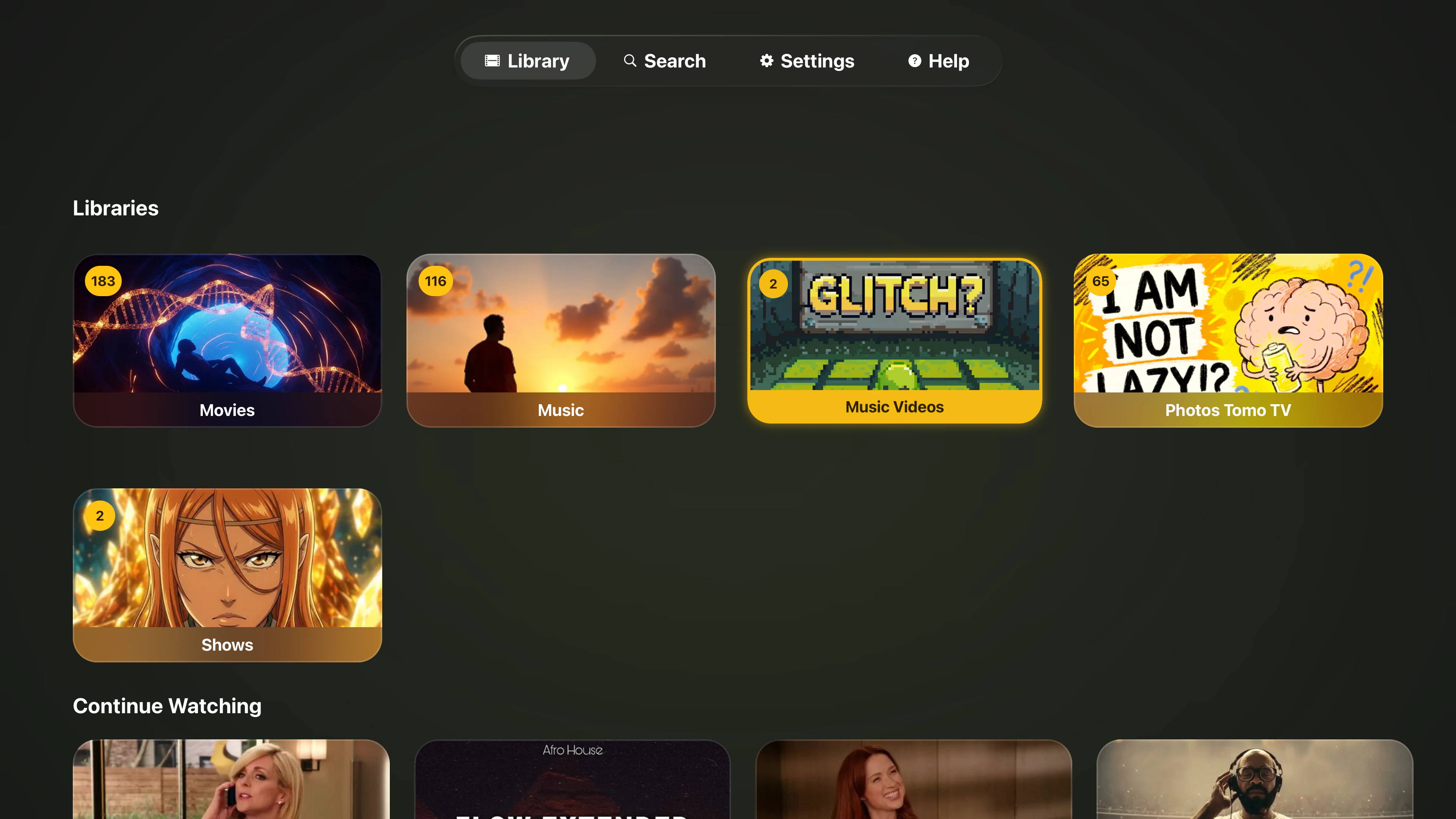 Tomo TV home screen with a Libraries row of Movies, Music, Music Videos, Photos TomoTV, and Shows tiles with item counts, above a local Continue Watching row