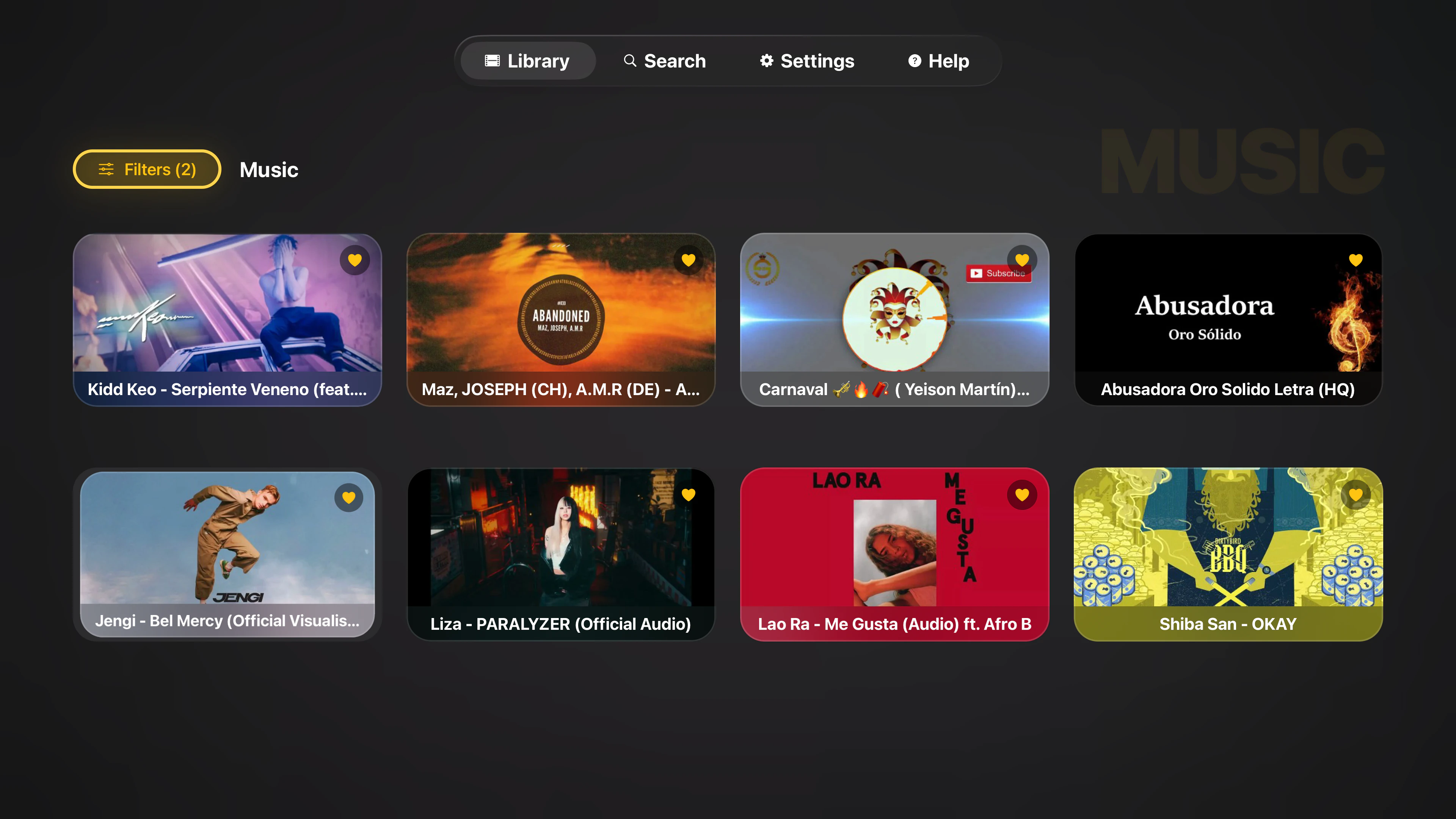 Tomo TV Music library grid with gold favorite hearts on each card and a Filters button showing two active filters