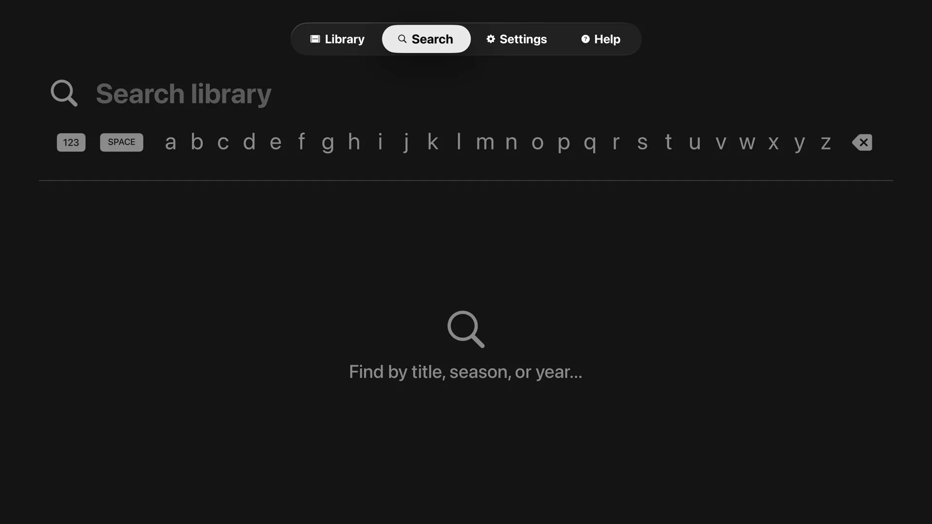 Tomo TV Search tab showing the native tvOS alphabet keyboard with the prompt Find by title, season, or year and a magnifying glass empty state