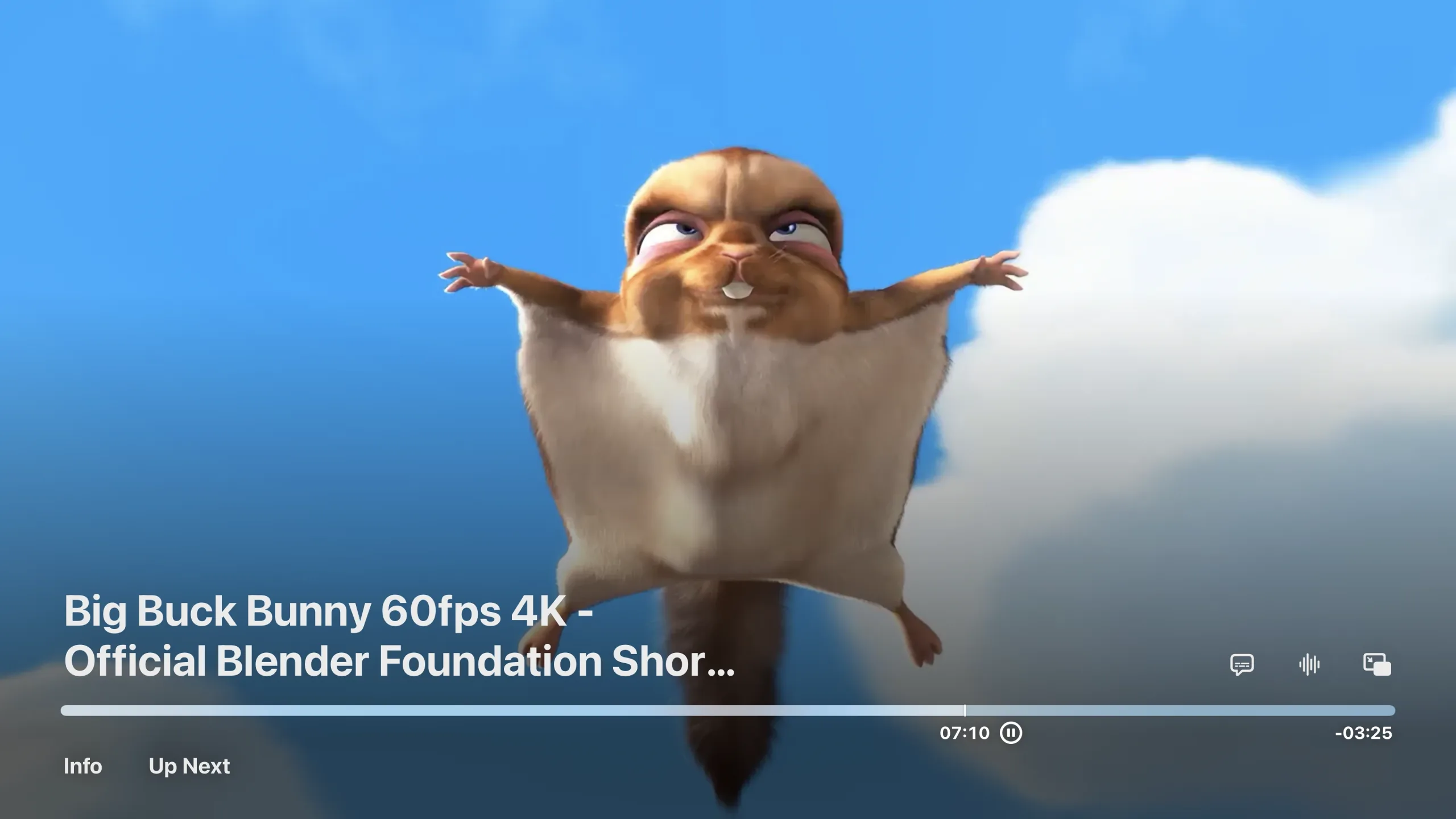 Big Buck Bunny playing in the native tvOS player: the system transport bar reading 07:10 elapsed and 03:25 remaining, the file's own name over the video, Info and Up Next buttons, and round controls for subtitles, audio track and Picture in Picture
